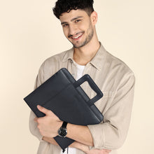 Load image into Gallery viewer, SASSORA Alba leather document holder in tan showing 13-inch MacBook inside padded sleeve